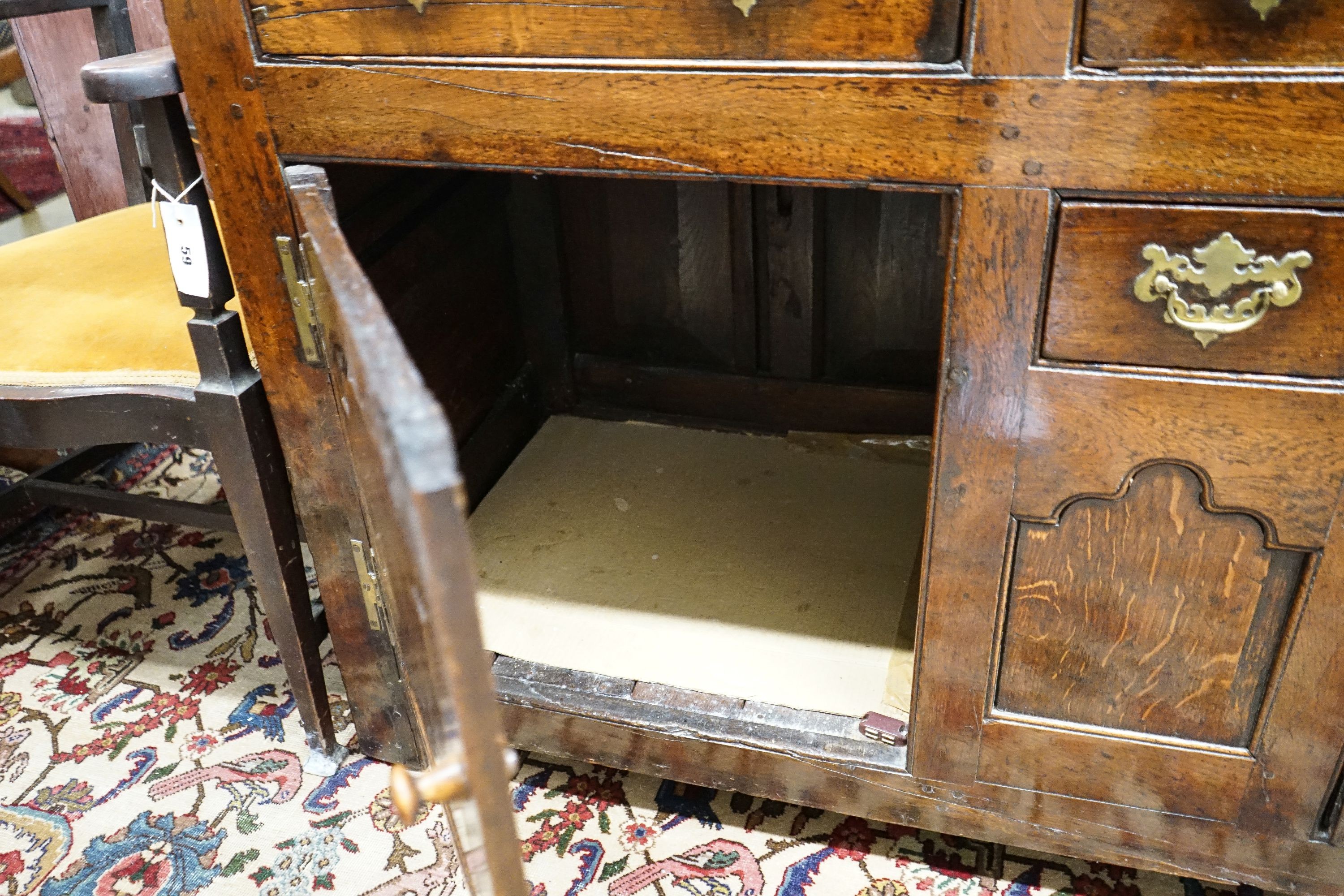 A mid 18th century oak dresser base, length 140cm, depth 55cm, height 88cm
